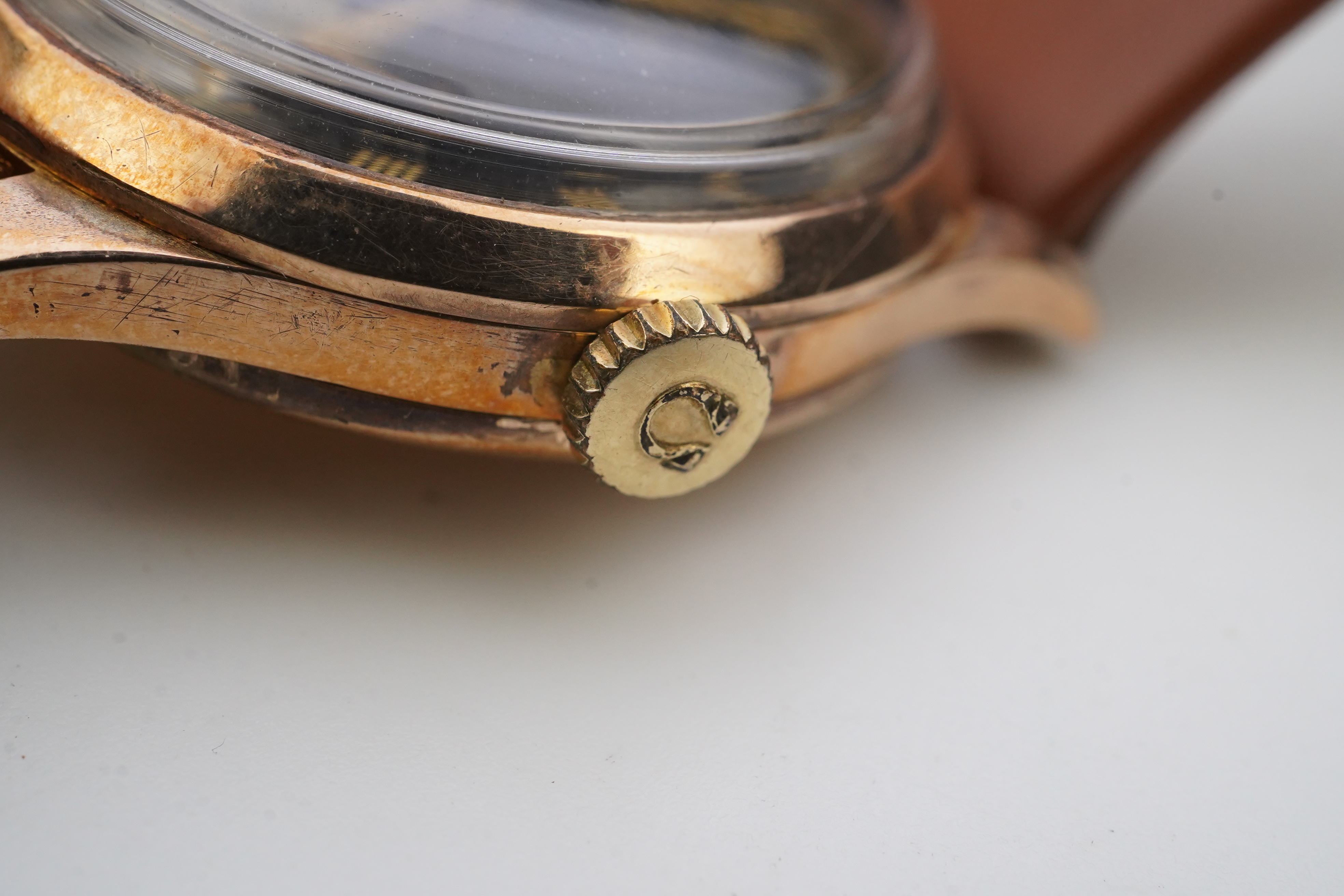 A gentleman's 1940's 9ct gold Omega manual wind wrist watch, on a later associated leather strap